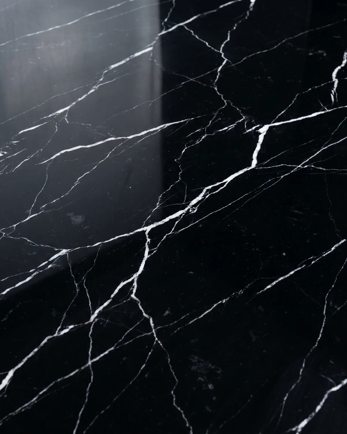 Black marble slab with a white lightning vein