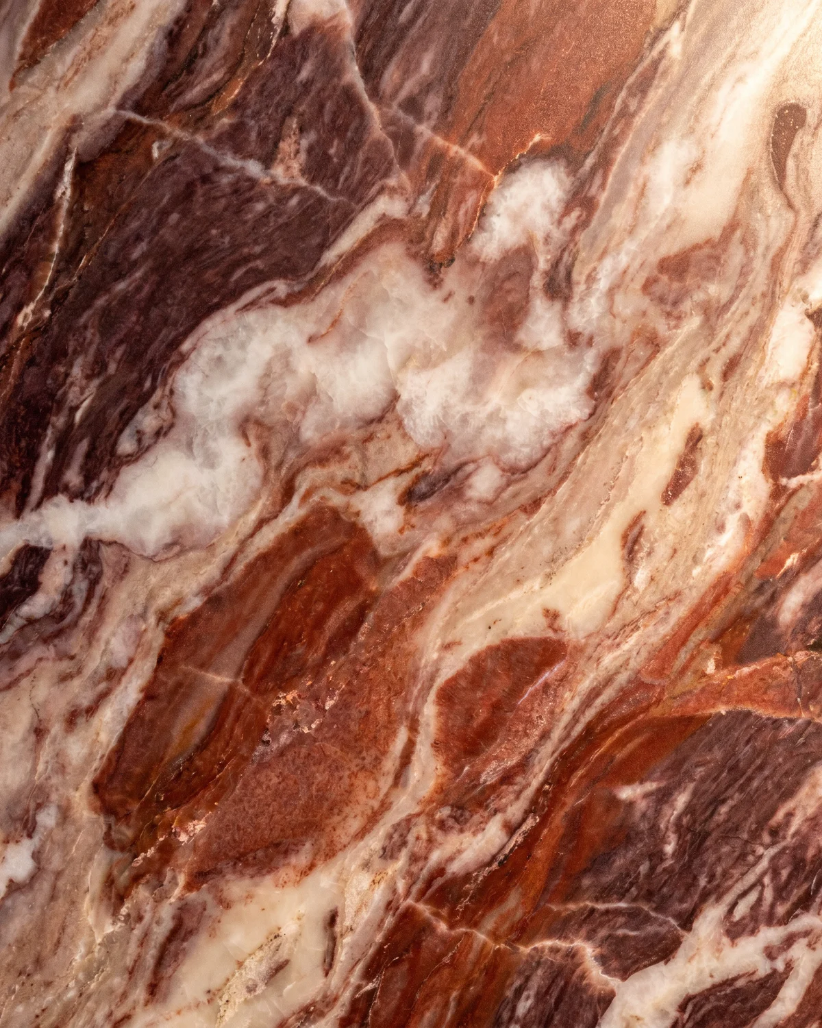 Burgundy red marble slab with cream cloud veining